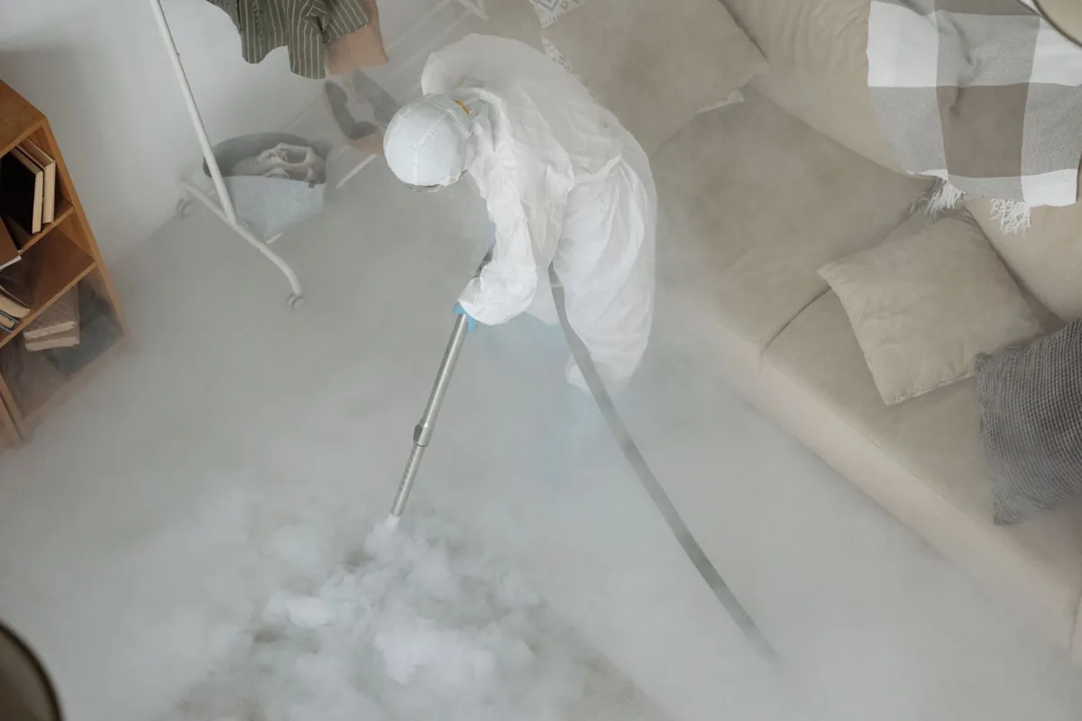 Biohazard cleanup technician in protective equipment, Bellair-Meadowbrook Terrace, FL